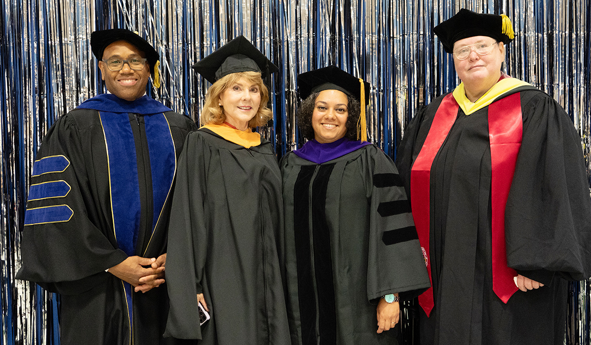 Photograph of trustees Phylicia Hancock Lewis and Paula Arno Martinez with President and Dean of Omak