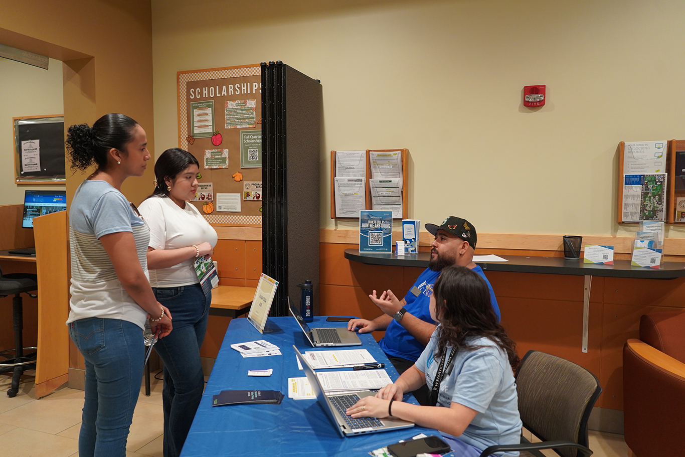 Staff helping students