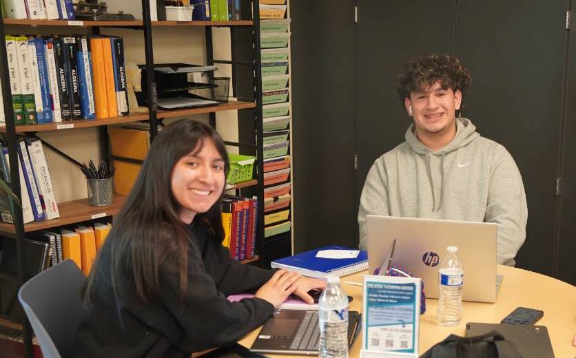 Two students sitting at a table in WVC's STEM center