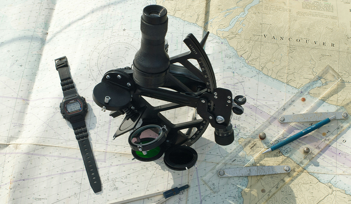 Drafting tools sit atop a map